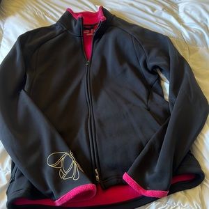It’s a puma zip up sweater black with pink Terri Cloth lining.